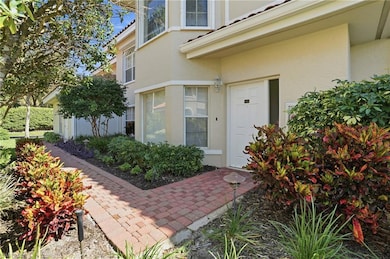 Doorway to property featuring stucco siding