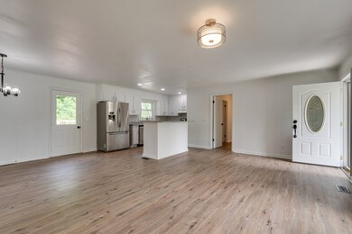 21x21 Living Room has a brick mantel and wood burning fireplace!