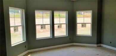 Master bedroom has bay window, dual closets, and t
