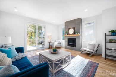 Spacious Living Room with Tile-Surround Fireplace