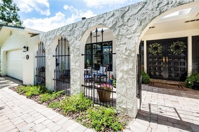 Courtyard with decorative iron and pavers.