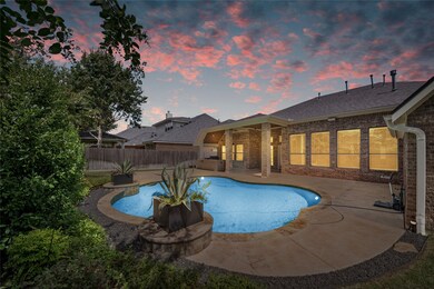 Step into outdoor comfort with this backyard oasis! Complete with an in-ground pool and outdoor kitchen area.