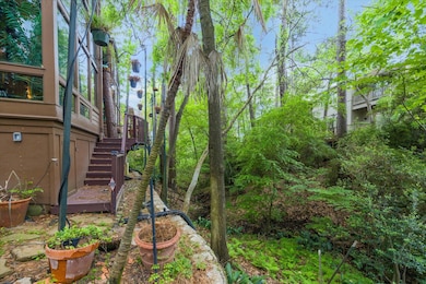 The back of the home features a wall of windows th