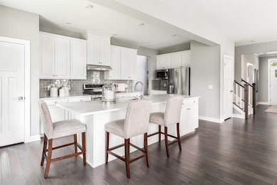 The cabinetry in this kitchen is AMAZING! There is a place for all of your cooking appliances. Spacious and user friendly!