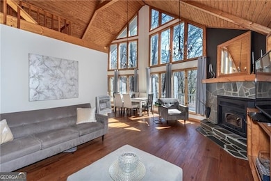 Living area with high vaulted ceiling, wood ceilin
