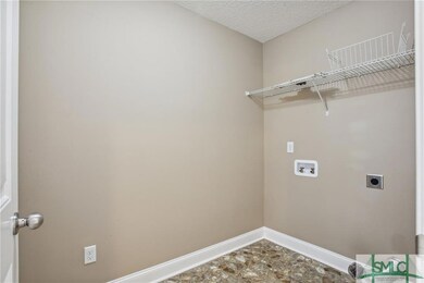 Laundry room, behind the door in photo is a double