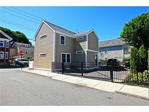 Exterior Back. Corner lot with parking off of Hall