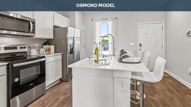 Kitchen with an island with sink, dark hardwood / 