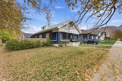 Bungalow-style house featuring a front yard and a mountain view