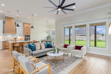 Living room with light hardwood / wood-style floor