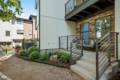 Property entrance featuring a porch and stone sid