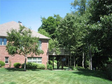 Exterior Back. Lovely grounds are maintained by th