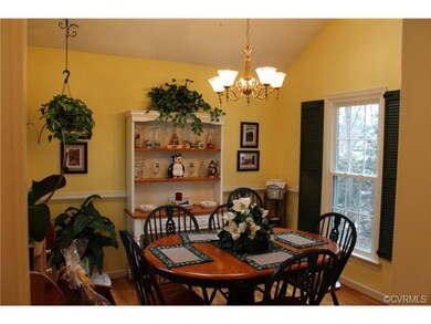 Dining Area with Vaulted Ceiling, Hardwood Floors,