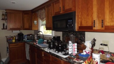 Cherry cabinets, gas stove top,...