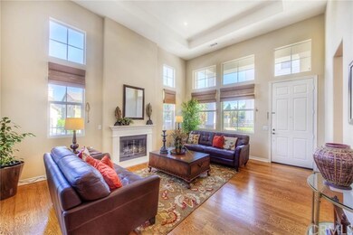 Sun-filled formal living room with high ceiling an