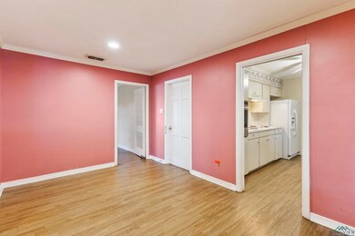 Empty room with light hardwood / wood-style floors
