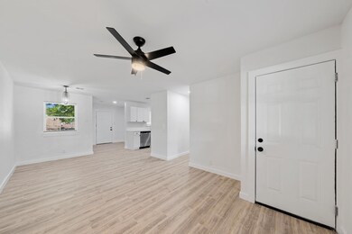 Unfurnished living room featuring light wood-type 