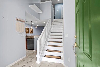 Staircase with tile patterned floors, baseboards, and recessed lighting
