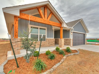 View of front facade with a garage, board and batt