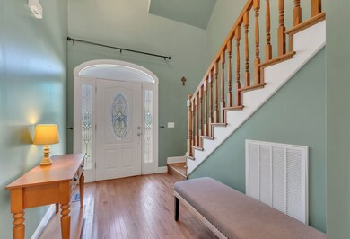 Front door and stair view from living area.