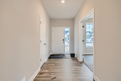 Foyer/Entry way with main level office and coat closet. Picture of previously completed model home. Please see listing agent for home specific selections.