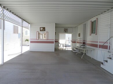 SPACIOUS CARPORT W/SHED