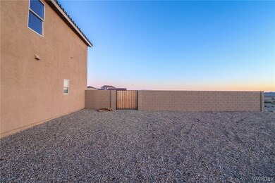 View of side yard at dusk
