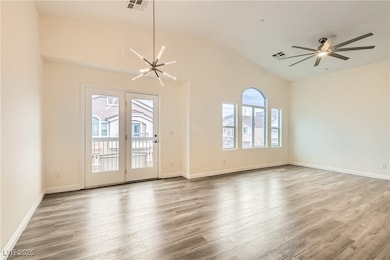 Unfurnished room featuring wood finished floors, v