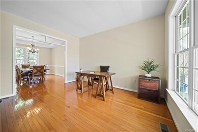 An abundance of natural light floods the formal li