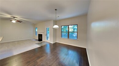 Unfurnished living room with carpet and ceiling fa