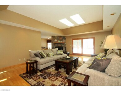 Great room also features stone fireplace and slide