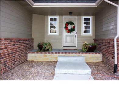 Covered front porch welcomes you and your guests. 