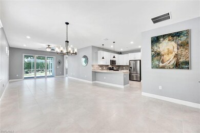 Unfurnished living room with ceiling fan with nota