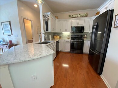 The new countertops are quartz. The new sink is re