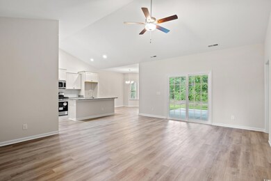 Unfurnished living room with ceiling fan with nota