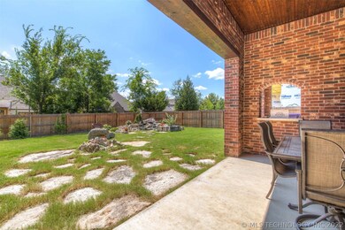 Off of the covered patio is rocks that lead to a g