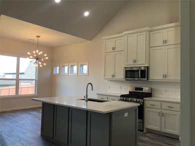 Kitchen featuring dark hardwood / wood-style floor