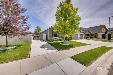 View of front of property featuring driveway and an attached garage