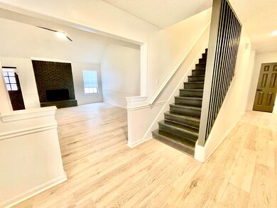 Stairway with a fireplace and hardwood / wood-styl