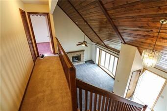View from 2nd floor into Great Room with stone fir