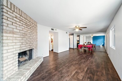 Wood burning fireplace and another large living ar