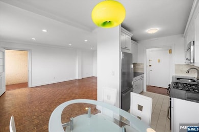 View of kitchen, dining area, terrace and living room