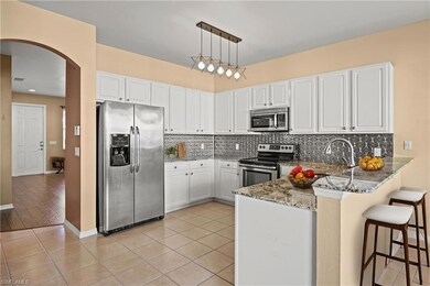 VIRTUALLY STAGED Kitchen with stone counters, ligh