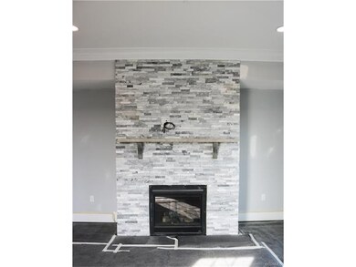 Beautiful fireplace in Family Room, with room for 