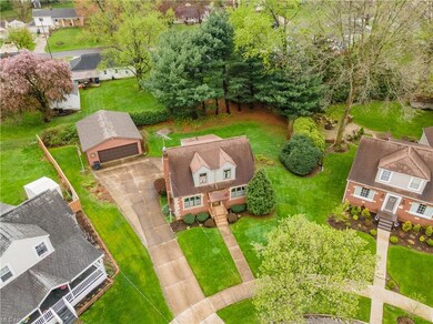 Overhead view of house, garage and property.