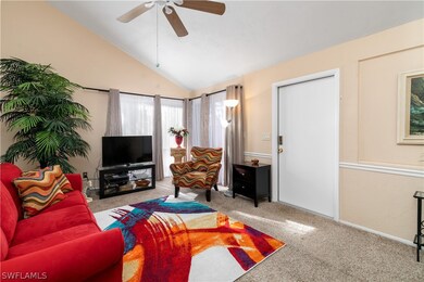 The living room has two sliders out to the screened lanai.