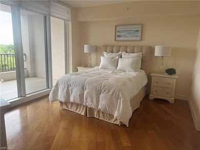 Bedroom featuring access to outside and wood-type flooring