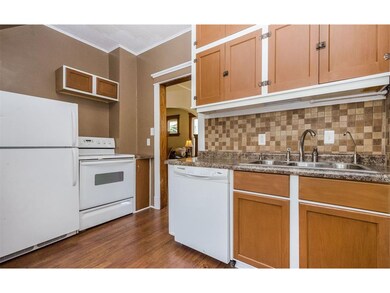 All new appliances and flooring as well as new fixtures in the kitchen.  Lots of storage in the cabinets and a pantry off the back as well!