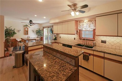 large updated kitchen with granite counter tops