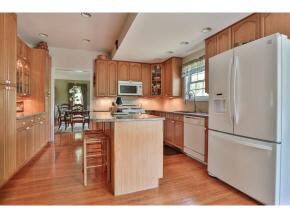 Large kitchen island with cabinets below. Granite 